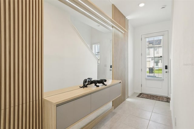 646 Longboat Dr, Davenport, FL 33896 - mudroom featuring baseboards and light tile patterned flooring