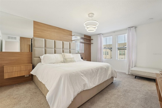 646 Longboat Dr, Davenport, FL 33896 - bedroom with a chandelier, visible vents, and light carpet