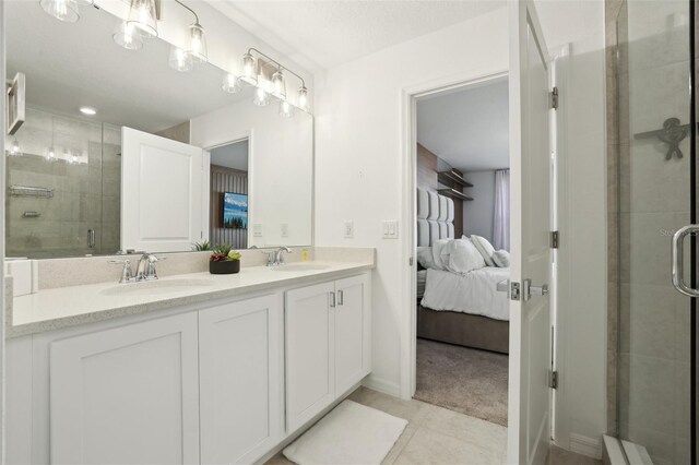 646 Longboat Dr, Davenport, FL 33896 - ensuite bathroom featuring double vanity, a stall shower, ensuite bathroom, and a sink