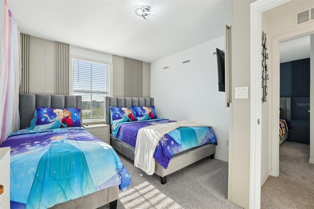 646 Longboat Dr, Davenport, FL 33896 - bedroom with visible vents and carpet flooring