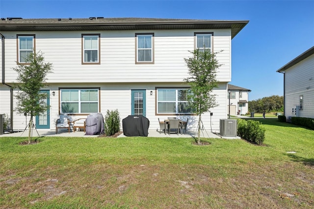646 Longboat Dr, Davenport, FL 33896 - back of property featuring central AC, a yard, and a patio area