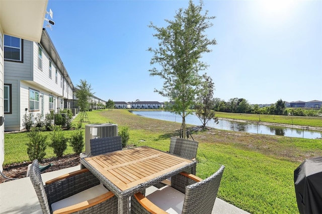 646 Longboat Dr, Davenport, FL 33896 - view of patio / terrace with a water view, outdoor dining space, and cooling unit