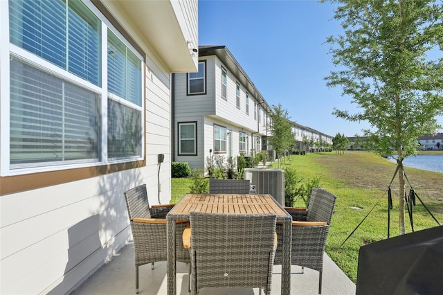 646 Longboat Dr, Davenport, FL 33896 - view of patio featuring cooling unit and outdoor dining area