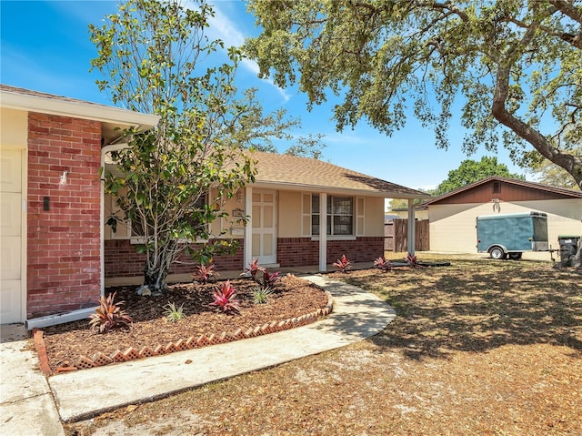 ranch-style house with brick siding