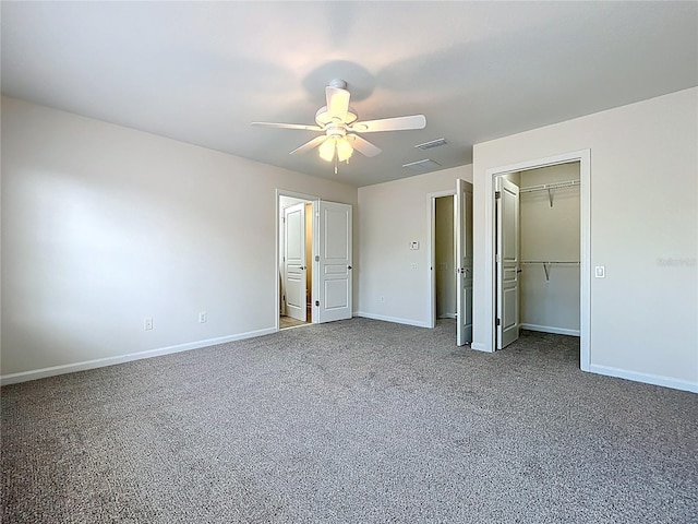 unfurnished bedroom with carpet, visible vents, a closet, baseboards, and ceiling fan