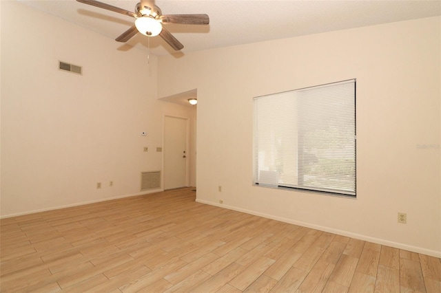 406 Red Coat Ln, Orlando, FL 32825 - unfurnished room with a ceiling fan, light wood-style flooring, lofted ceiling, and baseboards