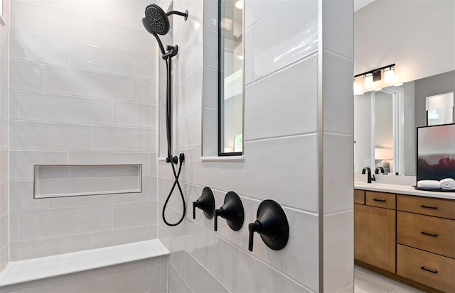 ensuite bathroom with ensuite bath, vanity, and tiled shower