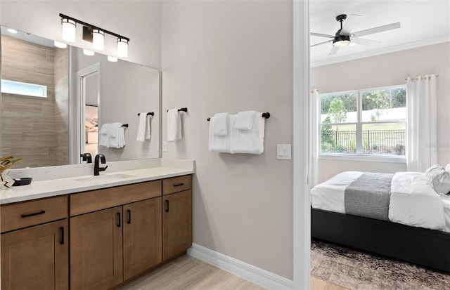 bathroom featuring plenty of natural light, baseboards, ensuite bath, and crown molding