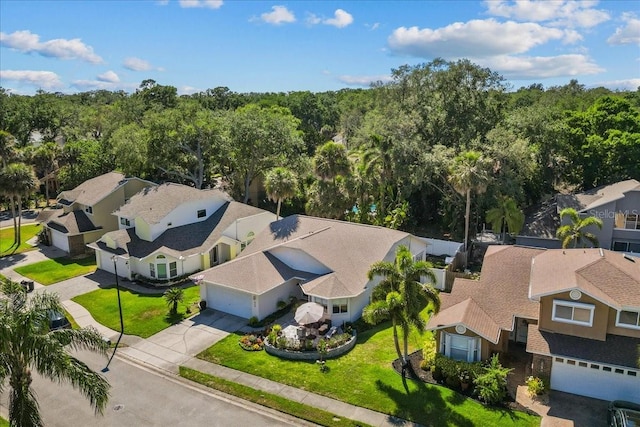 birds eye view of property with a residential view
