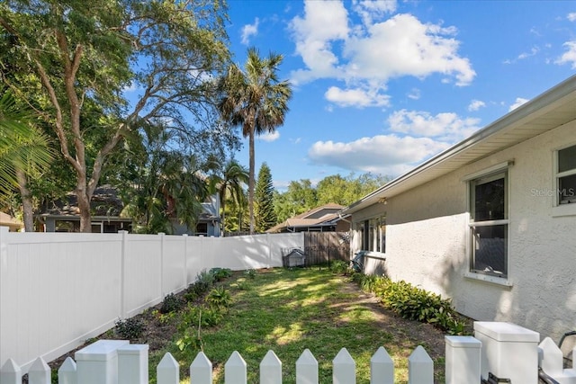 view of yard with a fenced backyard