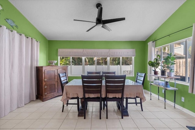 dining room featuring plenty of natural light, vaulted ceiling, and a ceiling fan