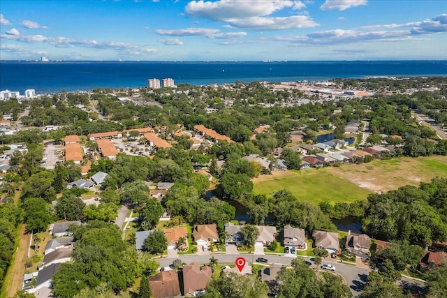 drone / aerial view featuring a residential view and a water view