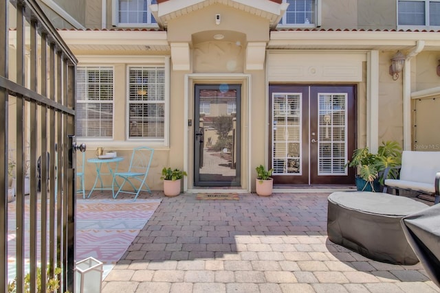 2840 Bella Vista Dr, Davenport, FL 33897 - view of exterior entry with a patio area, french doors, and stucco siding