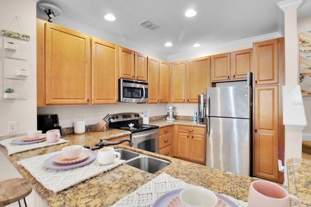 2840 Bella Vista Dr, Davenport, FL 33897 - kitchen featuring light stone counters, a peninsula, appliances with stainless steel finishes, visible vents, and recessed lighting