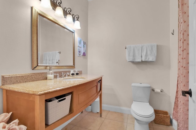 2840 Bella Vista Dr, Davenport, FL 33897 - full bathroom with toilet, vanity, tile patterned floors, and baseboards