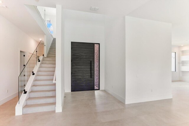 16825 Bolsena Dr, Montverde, FL 34756 - foyer with stairway and a fireplace