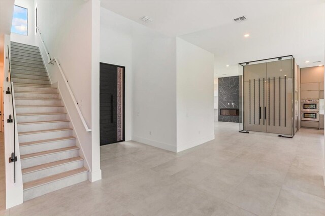 16825 Bolsena Dr, Montverde, FL 34756 - staircase with recessed lighting and baseboards
