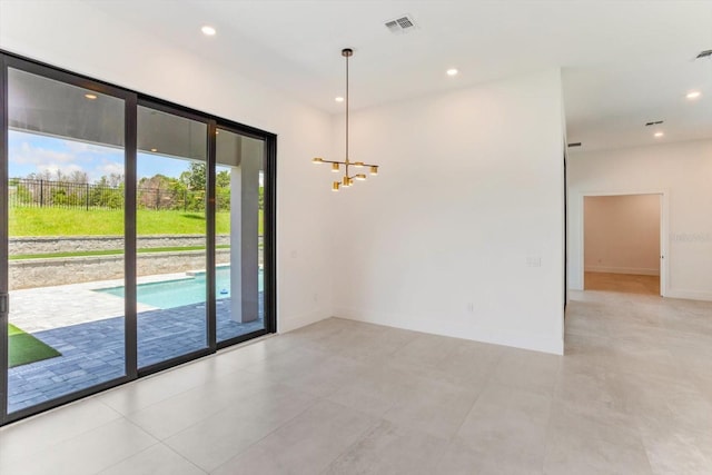 16825 Bolsena Dr, Montverde, FL 34756 - spare room with a chandelier, recessed lighting, and light tile patterned floors
