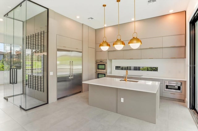 16825 Bolsena Dr, Montverde, FL 34756 - kitchen featuring stainless steel appliances, modern cabinets, light countertops, and pendant lighting