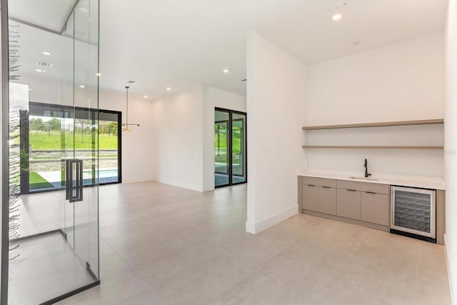 16825 Bolsena Dr, Montverde, FL 34756 - indoor wet bar featuring beverage cooler and recessed lighting