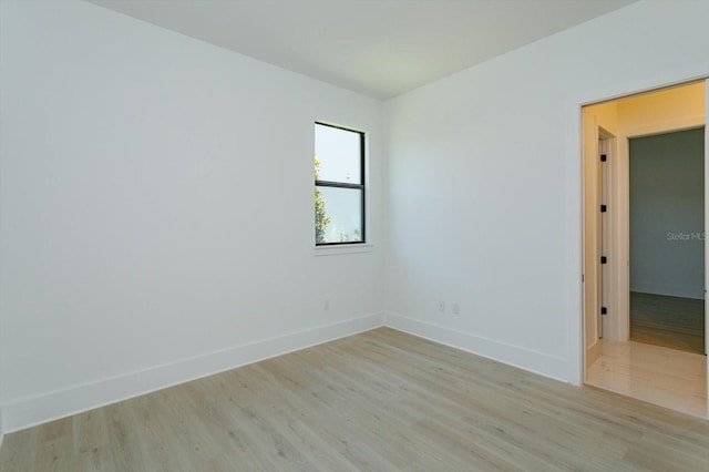 16825 Bolsena Dr, Montverde, FL 34756 - spare room featuring light wood-style flooring and baseboards