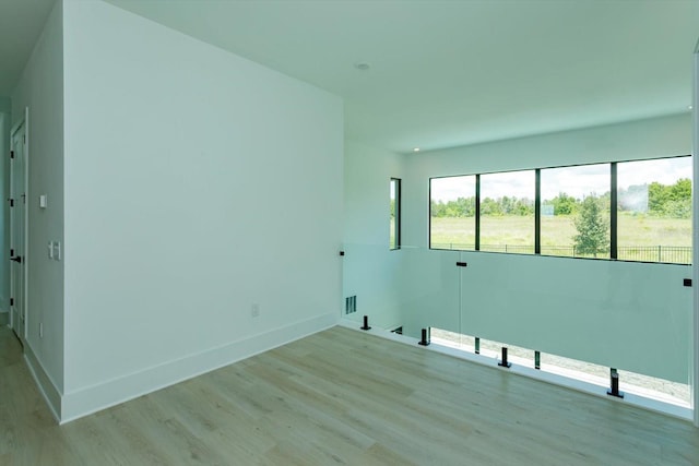 16825 Bolsena Dr, Montverde, FL 34756 - empty room featuring light wood-style floors