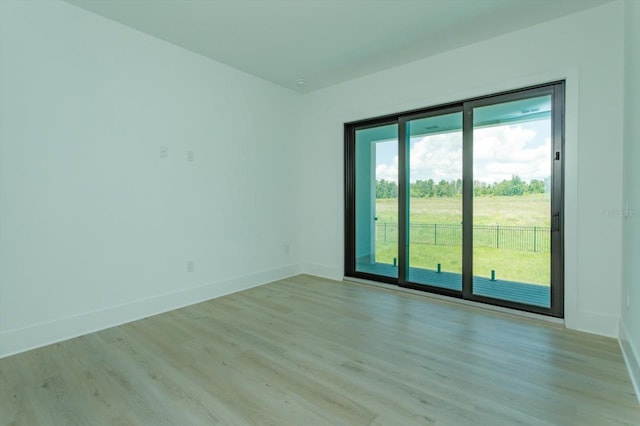 16825 Bolsena Dr, Montverde, FL 34756 - spare room with light wood-style floors and baseboards