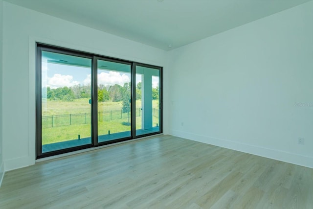 16825 Bolsena Dr, Montverde, FL 34756 - unfurnished room with light wood finished floors and baseboards