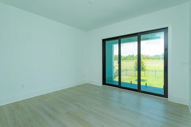 16825 Bolsena Dr, Montverde, FL 34756 - unfurnished room with light wood-type flooring and baseboards