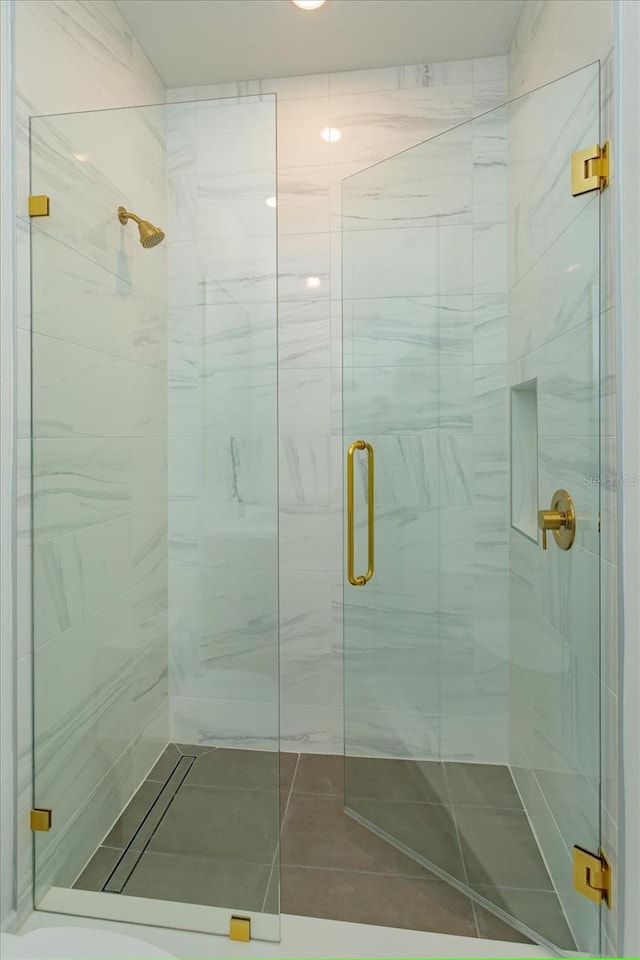 16825 Bolsena Dr, Montverde, FL 34756 - full bathroom featuring a stall shower and tile patterned flooring