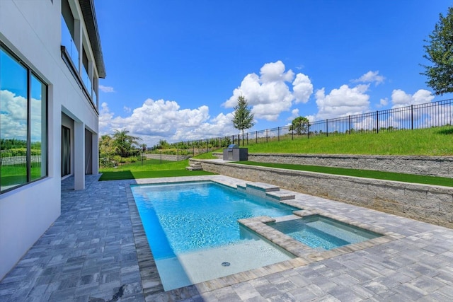 16825 Bolsena Dr, Montverde, FL 34756 - view of swimming pool featuring a pool with connected hot tub, a patio area, and a fenced backyard