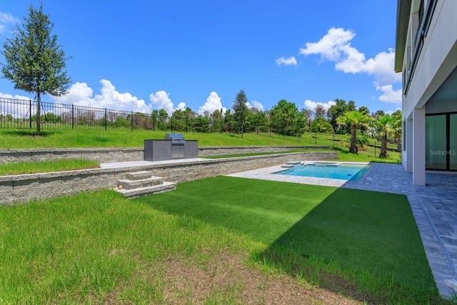 16825 Bolsena Dr, Montverde, FL 34756 - fenced backyard with a patio and exterior kitchen