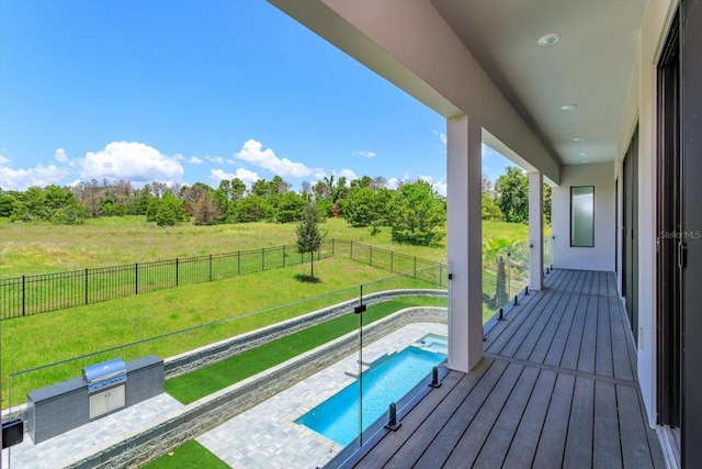 16825 Bolsena Dr, Montverde, FL 34756 - wooden terrace with a fenced backyard and a pool with connected hot tub