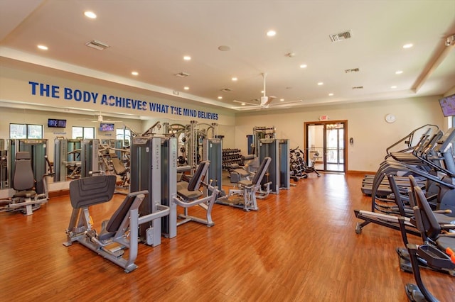 16825 Bolsena Dr, Montverde, FL 34756 - workout area with ceiling fan, wood finished floors, recessed lighting, and a raised ceiling