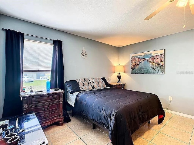 7721 SW 130th Ln, Ocala, FL 34473 - bedroom with baseboards, a textured ceiling, and light tile patterned floors