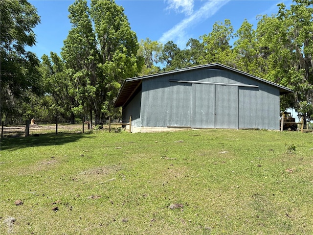 view of pole building with a yard