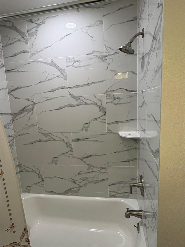bathroom featuring washtub / shower combination