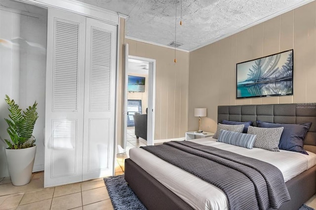 bedroom featuring light tile patterned floors