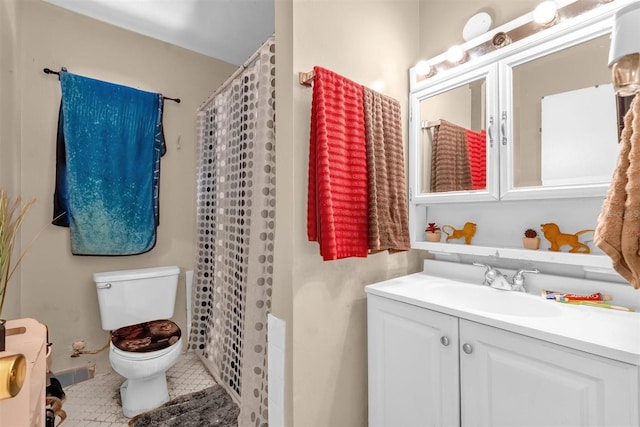 bathroom with tile patterned flooring, toilet, a shower with curtain, and vanity