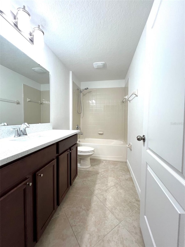 full bathroom with a textured ceiling, tile patterned floors, vanity, toilet, and shower / bathtub combination