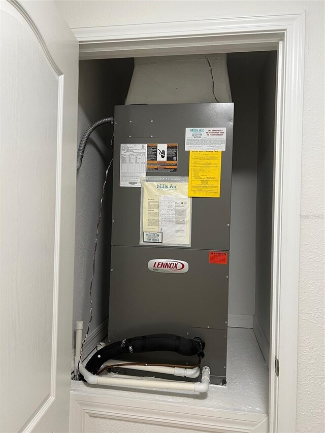 utility room with heating unit