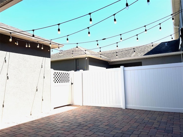 view of patio / terrace featuring fence and a gate