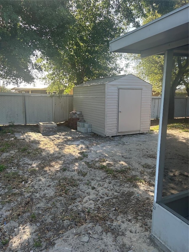 view of shed with fence
