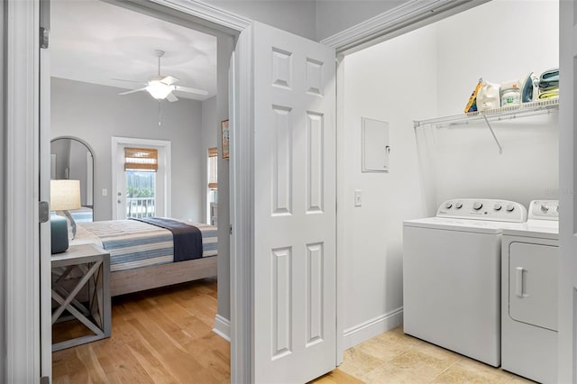 laundry area with a ceiling fan, baseboards, and washer and dryer