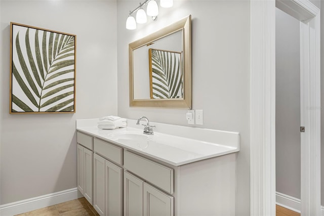 bathroom with baseboards and vanity