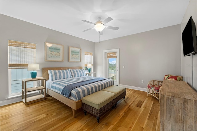bedroom featuring light wood-style flooring, access to exterior, baseboards, and ceiling fan
