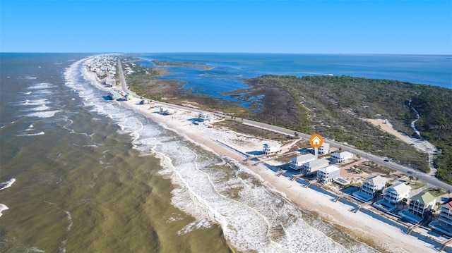 birds eye view of property with a view of the beach and a water view