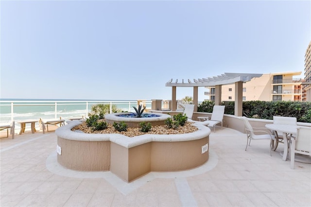 4071 S Atlantic Ave Unit 803, New Smyrna Beach, FL 32169 - view of patio / terrace featuring a water view, a pergola, and outdoor dining space