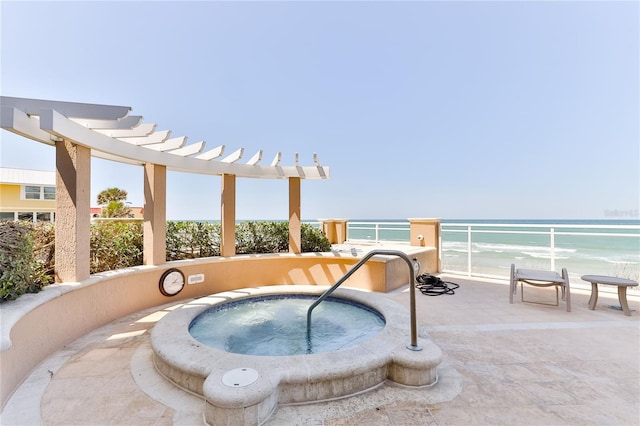 4071 S Atlantic Ave Unit 803, New Smyrna Beach, FL 32169 - view of swimming pool with a community hot tub, a water view, and a pergola