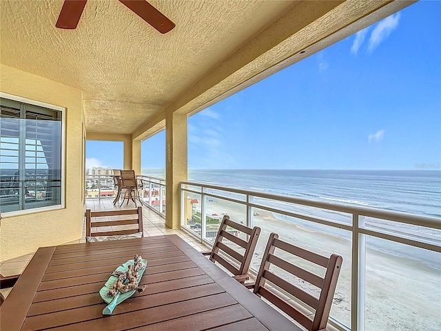 4071 S Atlantic Ave Unit 803, New Smyrna Beach, FL 32169 - balcony featuring view of water and beach and a ceiling fan